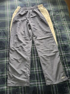 Vintage 2000s Reebok Navy blue track pants with grey stripe, Size XL.